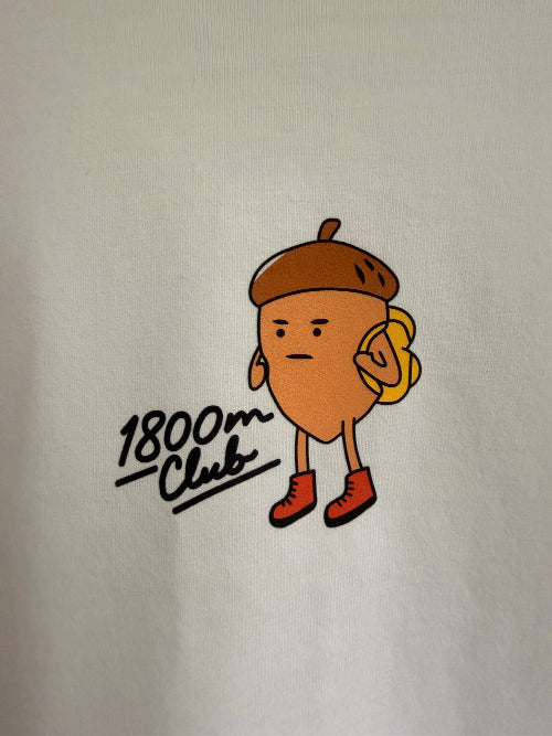 A close-up of a white t-shirt with the Eichhörnliweg front center design with handwritten text '1800m Club'.