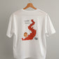 A white short-sleeve t-shirt hanging on a wooden hanger against a beige wall. The shirt features a graphic print of a the nut character and squirrel path in Arosa and black text.